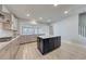 Open kitchen design with stainless appliances, island with dark cabinetry, and light countertops at 905 Monmouth Dr., Myrtle Beach, SC 29588