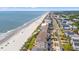 Coastal community aerial view showcasing beautiful homes and condos along the beach, with ocean views at 917 S Ocean Blvd. # 103, Surfside Beach, SC 29575