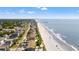 Aerial view showing the beach, the neighborhood and pier at 917 S Ocean Blvd. # 103, Surfside Beach, SC 29575