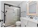 Clean, tiled bathroom with glass enclosed shower and modern fixtures at 917 S Ocean Blvd. # 103, Surfside Beach, SC 29575