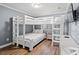 A well-organized room with a bunk bed, perfect for , featuring a built-in TV at 917 S Ocean Blvd. # 103, Surfside Beach, SC 29575