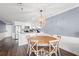 Living space with a kitchen island and dining table, creating a seamless flow for entertaining at 917 S Ocean Blvd. # 103, Surfside Beach, SC 29575