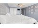 Comfortable main bedroom with king bed, fan, closet, and nautical decorations at 917 S Ocean Blvd. # 103, Surfside Beach, SC 29575