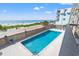 Sparkling pool with ocean view and building at 917 S Ocean Blvd. # 103, Surfside Beach, SC 29575