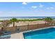 Community pool with beach views and lounge chairs at 917 S Ocean Blvd. # 103, Surfside Beach, SC 29575