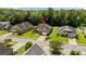 Aerial view of a home with well-manicured lawn, mature trees, and a beautiful neighborhood at 950 Henry James Dr., Myrtle Beach, SC 29579