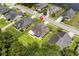 Aerial view showcases a beautiful home with lush lawn, trees, and proximity to a pond at 950 Henry James Dr., Myrtle Beach, SC 29579