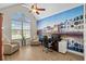 Home office featuring an arched window, ceiling fan and custom wall art at 950 Henry James Dr., Myrtle Beach, SC 29579