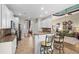 Open kitchen features white cabinets, granite countertops, bar seating and easy access to dining and living areas at 950 Henry James Dr., Myrtle Beach, SC 29579