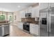 The kitchen features stainless appliances, white cabinetry, tile backsplash and granite countertops at 950 Henry James Dr., Myrtle Beach, SC 29579