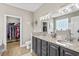 Main bathroom featuring a double sink vanity, walk-in closet and decorative finishes at 950 Henry James Dr., Myrtle Beach, SC 29579