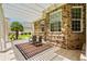 This is a view of the outdoor patio with brick wall and pergola that provides shade at 950 Henry James Dr., Myrtle Beach, SC 29579