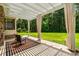 This outdoor patio features a pergola with shades and a great view of the green backyard at 950 Henry James Dr., Myrtle Beach, SC 29579