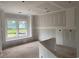 Unfinished living room featuring large windows providing natural light and an open design at 977 Oak Hollow St., Longs, SC 29568