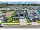 A high aerial shot showcases the beautiful neighborhood and the lovely home with manicured lawns at 1012 Mary Read Dr., North Myrtle Beach, SC 29582