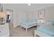 Bright bedroom featuring two twin beds and neutral decor, creating a serene atmosphere at 1012 Mary Read Dr., North Myrtle Beach, SC 29582
