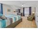 Comfortable bedroom features neutral tones, ceiling fan, and large dresser with mirror at 1012 Mary Read Dr., North Myrtle Beach, SC 29582