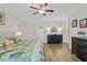 Inviting bedroom features wood flooring, queen bed, and dresser with ample storage space at 1012 Mary Read Dr., North Myrtle Beach, SC 29582