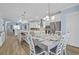 A kitchen dining area with a table set for six that flows into a spacious kitchen at 1012 Mary Read Dr., North Myrtle Beach, SC 29582