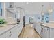 Bright kitchen with stainless steel appliances, white cabinets, and white countertops at 1012 Mary Read Dr., North Myrtle Beach, SC 29582