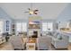 Inviting living room features a stone fireplace, hardwood floors, and is brightly lit with many seating options at 1012 Mary Read Dr., North Myrtle Beach, SC 29582