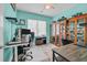 Bright office space with a large window, a ceiling fan, and display cabinets for collectibles at 1012 Mary Read Dr., North Myrtle Beach, SC 29582