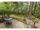 Patio with table and chairs and a lush backyard at 1028 Fairway Ln. # 71, Conway, SC 29526