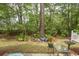 Green backyard, partially shaded by mature trees at 1028 Fairway Ln. # 71, Conway, SC 29526