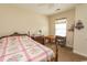Comfortable bedroom with a quilted bedspread, natural light, and stylish decor at 1028 Fairway Ln. # 71, Conway, SC 29526