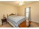 Bedroom featuring a large bed, ceiling fan, and window, with wood accents at 1028 Fairway Ln. # 71, Conway, SC 29526