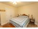 Cozy bedroom featuring a double bed, a fan and closet space at 1028 Fairway Ln. # 71, Conway, SC 29526