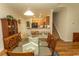 Dining room with a glass table and seating for six adjacent to kitchen at 1028 Fairway Ln. # 71, Conway, SC 29526