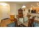 Dining room with a glass table and seating for six adjacent to kitchen at 1028 Fairway Ln. # 71, Conway, SC 29526