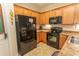 Well-equipped kitchen features black appliances, abundant cabinets, and granite countertops at 1028 Fairway Ln. # 71, Conway, SC 29526