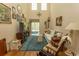 Bright living room with high ceilings, neutral walls, and hardwood floors at 1028 Fairway Ln. # 71, Conway, SC 29526