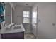 Bathroom featuring a double vanity sink, tile floors, and a window for natural light at 1029 Tee Shot Dr. # 1029, Conway, SC 29526