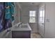 Bathroom featuring a double vanity sink, tile floors, and a window for natural light at 1029 Tee Shot Dr. # 1029, Conway, SC 29526