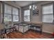 Bright dining area with hardwood floors, three windows, and modern chandelier at 1029 Tee Shot Dr. # 1029, Conway, SC 29526