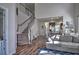 Open concept living space featuring a staircase, hardwood floors, and seamless flow to the kitchen at 1029 Tee Shot Dr. # 1029, Conway, SC 29526