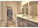 Bathroom featuring a double vanity sink, tile floors, and a walk-in closet for ample storage at 1029 Tee Shot Dr. # 1029, Conway, SC 29526