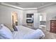 Well-lit main bedroom with a tray ceiling, carpeted floors, and a view into the living room at 1029 Tee Shot Dr. # 1029, Conway, SC 29526