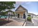 Community pool with a building nearby and black metal fence at 1029 Tee Shot Dr. # 1029, Conway, SC 29526