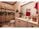 Bathroom featuring boat-themed shower curtain, decorative accents, and vanity with ample counter space at 1058 Sea Mountain Hwy. # 3-201, North Myrtle Beach, SC 29582