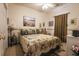 Comfortable bedroom featuring carpet, seashell bedding and artwork and a ceiling fan at 1058 Sea Mountain Hwy. # 3-201, North Myrtle Beach, SC 29582
