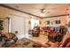 Warm living room with wood floors, decoratively trimmed walls, a ceiling fan, and comfortable seating at 1058 Sea Mountain Hwy. # 3-201, North Myrtle Beach, SC 29582