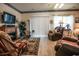 Inviting living room with fireplace, plush seating, and natural light at 1058 Sea Mountain Hwy. # 3-201, North Myrtle Beach, SC 29582