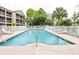 Resort-style pool with white fence and ample seating at 1058 Sea Mountain Hwy. # 3-201, North Myrtle Beach, SC 29582