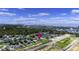 Aerial view of neighborhood houses, a river, and the coastline in the distance under a blue sky at 1106 Tarpon Pond Rd., North Myrtle Beach, SC 29582
