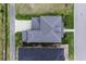 Overhead view of a house with a gray roof and a paved driveway, surrounded by green grass at 1106 Tarpon Pond Rd., North Myrtle Beach, SC 29582
