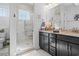 Well-lit bathroom featuring a glass shower, double vanity, and modern fixtures at 1106 Tarpon Pond Rd., North Myrtle Beach, SC 29582